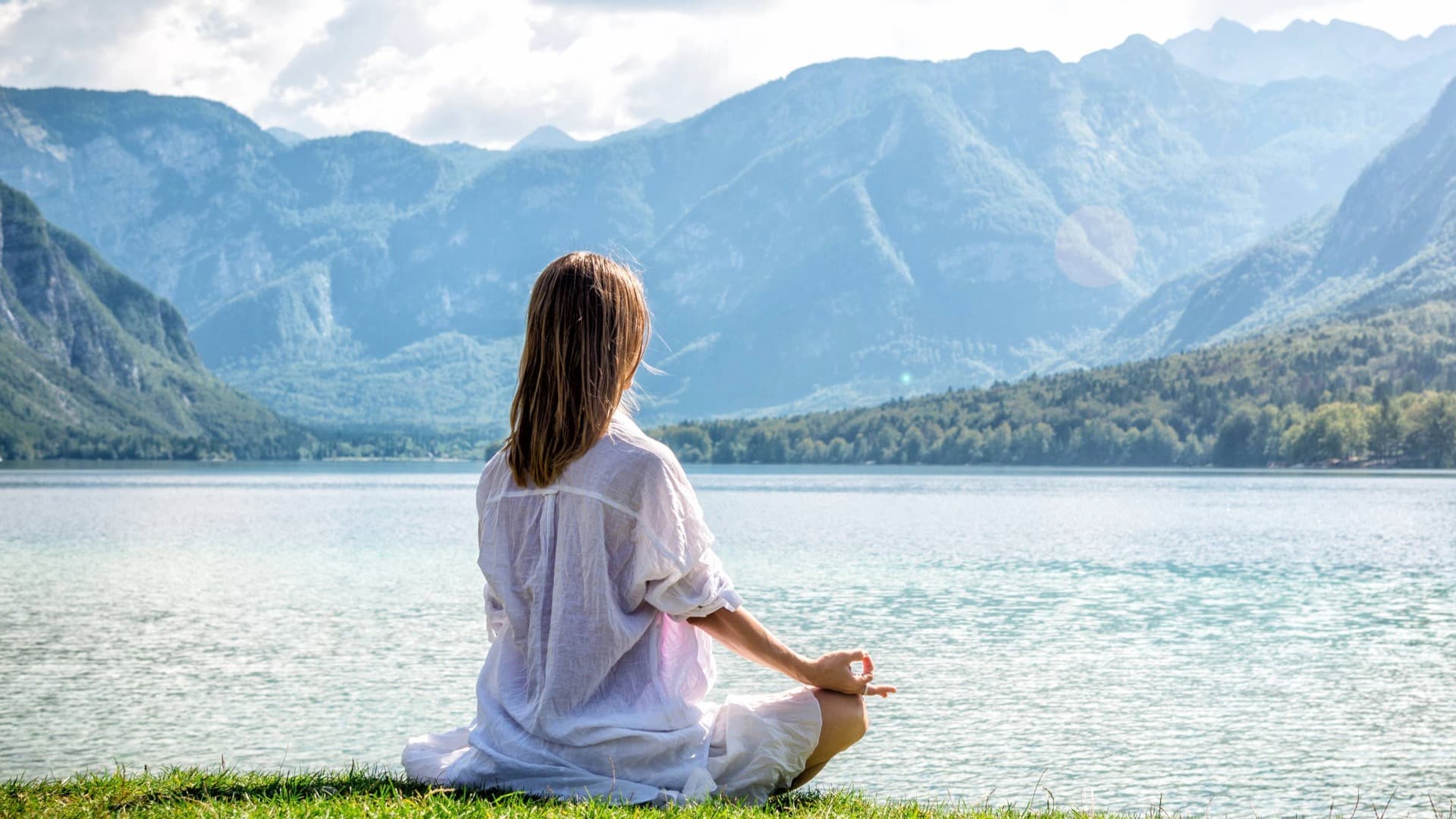 Person in calm setting at sunrise